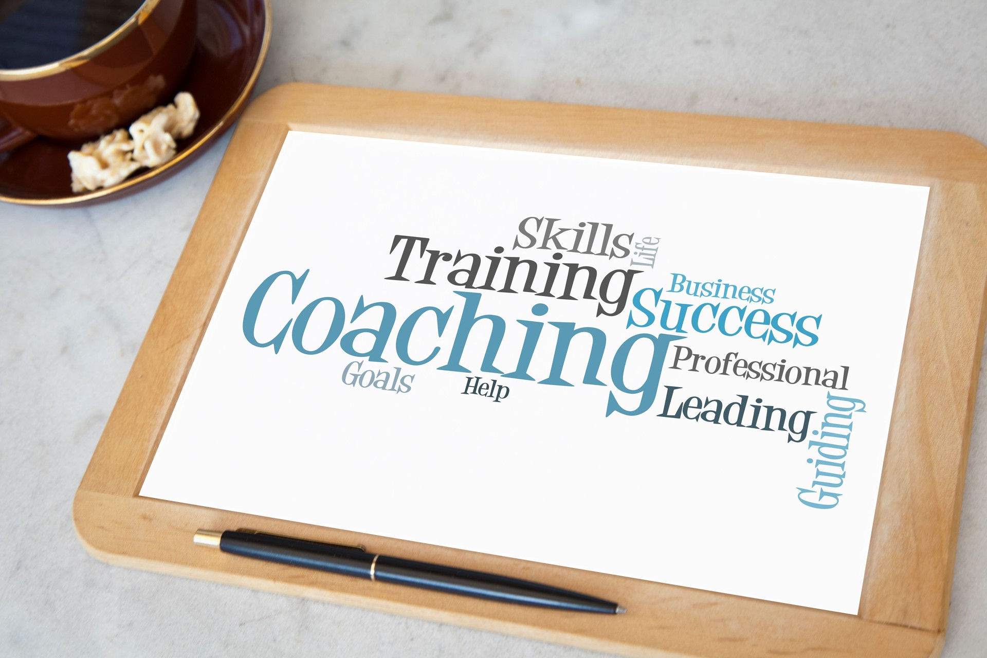 blackboard with coaching word cloud